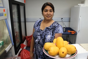 Dr. Mary Anne Amalardjou with mangoes from a recent research project