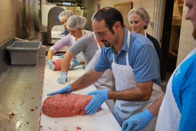 ANSC Professor Rich Mancini working with processed meat in the Meat Lab located on the Storrs Campus