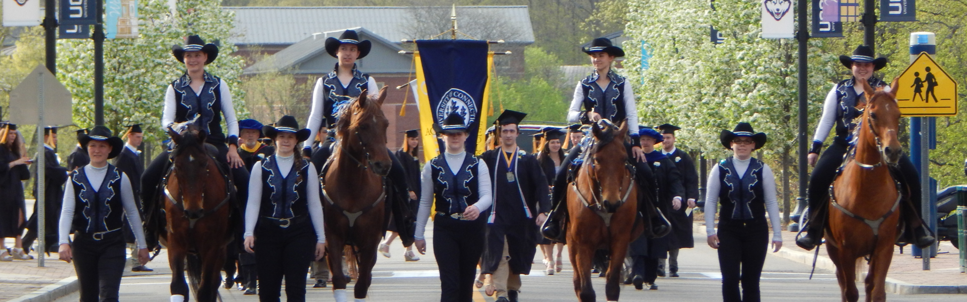 Students riding horses during commencement