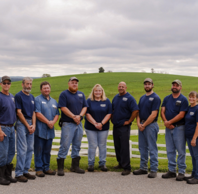 Kellogg Dairy Center staff posing for group photo in front of Horsebarn Hill.