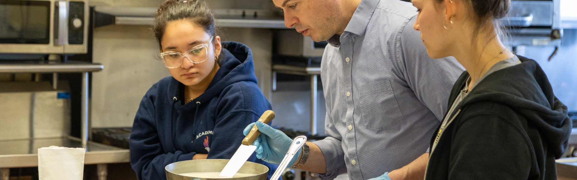 Students and faculty making mozzarella in the Jones Building.