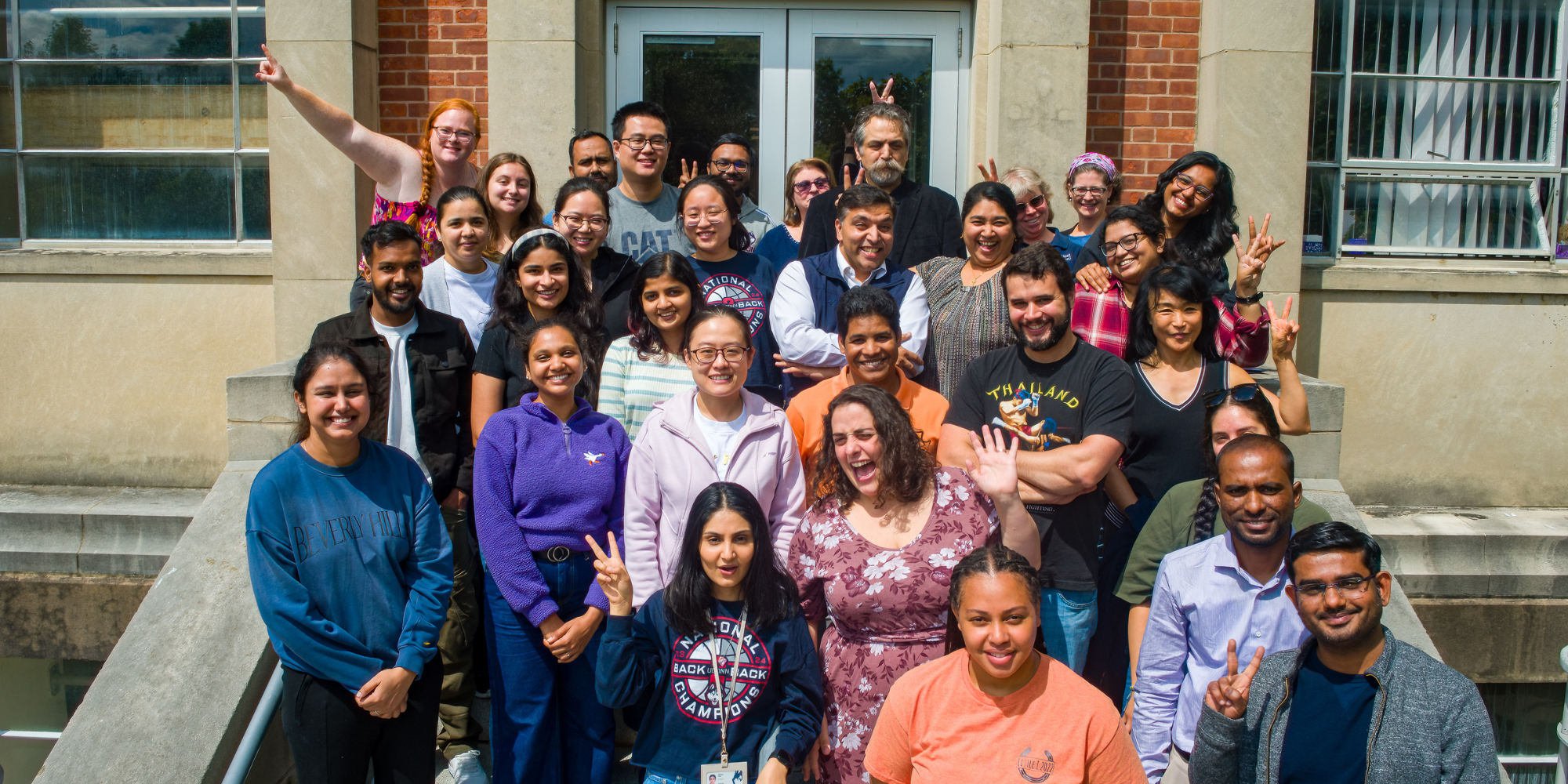 Students posing outside of the George White Building