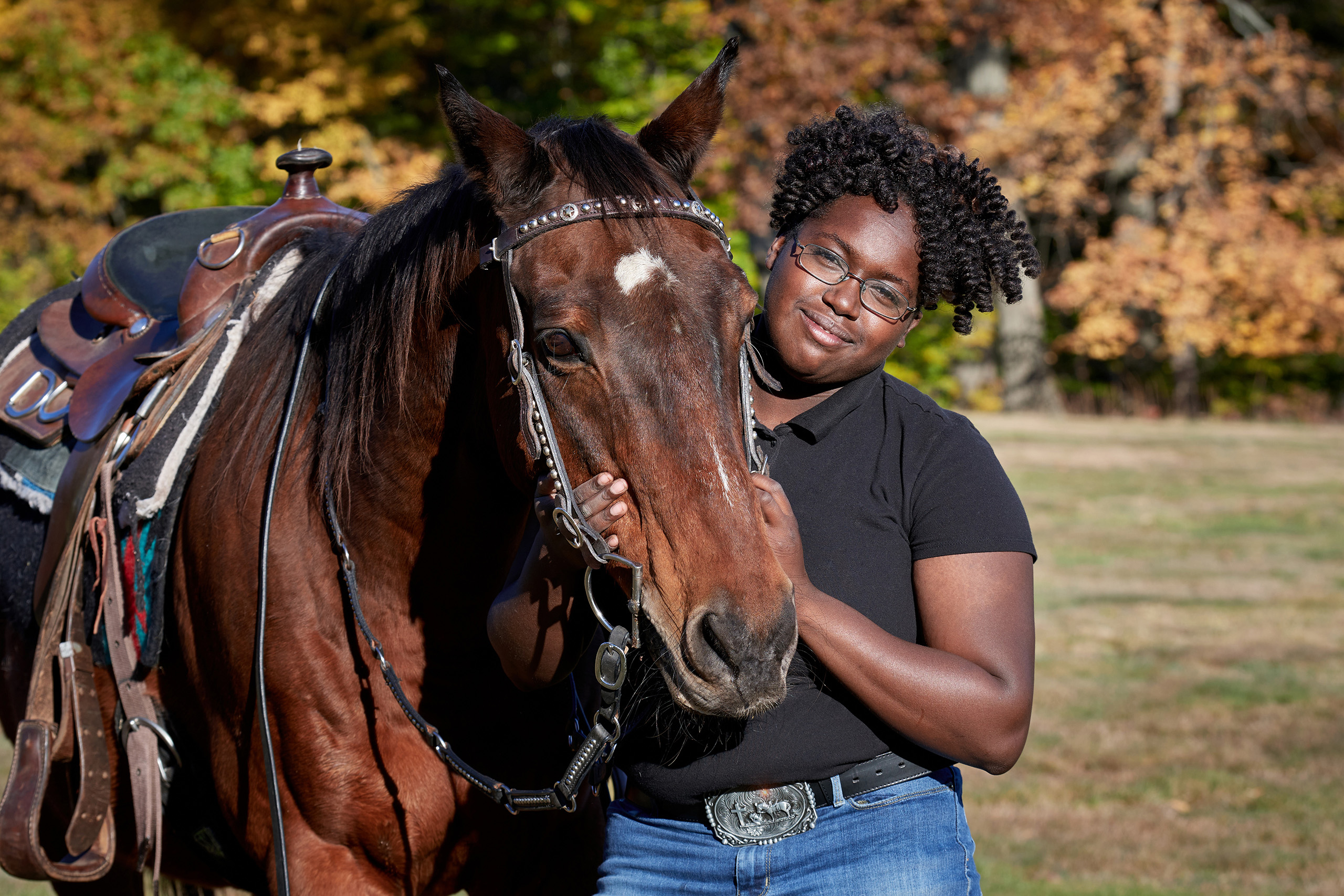 Woman standing with a horse