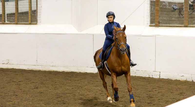 Student Riding Horse