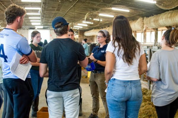 Students receiving lecture inside of dairy center.